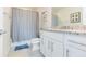 Well-lit bathroom showcasing granite counters, a modern vanity, and a neutral color scheme at 20925 Monza Loop, Land O Lakes, FL 34638