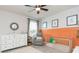 Charming Bedroom with stylish decor, modern crib, and cozy gray chair at 20925 Monza Loop, Land O Lakes, FL 34638