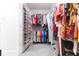 Walk-in closet with clothing racks and shelving providing an abundance of storage space at 20925 Monza Loop, Land O Lakes, FL 34638