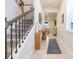 Inviting foyer with staircase featuring an ornate iron railing at 20925 Monza Loop, Land O Lakes, FL 34638