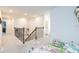 Light-filled hallway with a staircase and views of adjoining rooms at 20925 Monza Loop, Land O Lakes, FL 34638