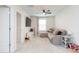 Inviting living room featuring comfortable seating, a ceiling fan, and natural light at 20925 Monza Loop, Land O Lakes, FL 34638