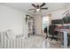 Cozy home office with ample storage, a comfortable chair, and natural light at 20925 Monza Loop, Land O Lakes, FL 34638