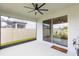 Covered patio with ceiling fan, overlooking the backyard at 20925 Monza Loop, Land O Lakes, FL 34638