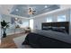 Relaxing bedroom showcasing a large bed, stylish decor, and plenty of natural light at 2121 Secret Cv, Odessa, FL 33556