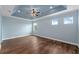 Bright and airy bedroom with hardwood floors, large windows, and a simple, elegant design at 2121 Secret Cv, Odessa, FL 33556