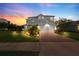 Beautiful two-story home featuring a spacious two-car garage and brick paved driveway at 2121 Secret Cv, Odessa, FL 33556