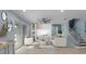 Airy living room with sleek furniture, modern decor, and an abundance of natural light from sliding glass doors at 2121 Secret Cv, Odessa, FL 33556