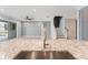 Spacious living area with modern ceiling fan, tile floors, staircase and view of the pool at 2121 Secret Cv, Odessa, FL 33556