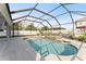 Inviting backyard oasis featuring a sparkling pool, perfect for relaxation and entertainment at 2121 Secret Cv, Odessa, FL 33556