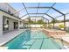 Beautiful screened in pool and spa surrounded by a spacious patio at 2121 Secret Cv, Odessa, FL 33556