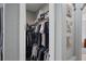Walk-in closet with ample storage space and well-organized clothing racks at 21604 Draycott Way, Land O Lakes, FL 34637