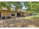 An inviting backyard featuring ample shade trees and a peaceful lawn at 2441 Hibiscus Bay Ln, Brandon, FL 33511