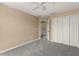 Clean, neutral bedroom featuring gray carpet and an open closet at 2441 Hibiscus Bay Ln, Brandon, FL 33511