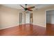 Large bedroom with hardwood floors, a ceiling fan, walk-in closet and attached bathroom at 2441 Hibiscus Bay Ln, Brandon, FL 33511