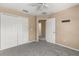 Bedroom featuring gray carpet and closet doors at 2441 Hibiscus Bay Ln, Brandon, FL 33511