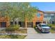 Bright townhome with a driveway and an attached one-car garage at 2441 Hibiscus Bay Ln, Brandon, FL 33511