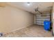 A spacious garage with tile floors and a garage door at 2441 Hibiscus Bay Ln, Brandon, FL 33511