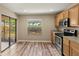 Bright kitchen with wood cabinets, stainless steel appliances and a view to the backyard at 2441 Hibiscus Bay Ln, Brandon, FL 33511
