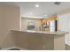 Cozy kitchen featuring wood cabinets, stainless steel appliances, and an inviting breakfast bar at 2441 Hibiscus Bay Ln, Brandon, FL 33511