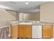 Bright kitchen with a stainless steel sink and dishwasher, with wood cabinets at 2441 Hibiscus Bay Ln, Brandon, FL 33511