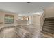 Spacious living area with hardwood floors next to open kitchen at 2441 Hibiscus Bay Ln, Brandon, FL 33511