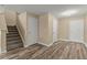 Spacious living room with stairs features hardwood floors and neutral walls at 2441 Hibiscus Bay Ln, Brandon, FL 33511