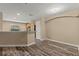 Open-concept living room with hardwood floors open to the kitchen at 2441 Hibiscus Bay Ln, Brandon, FL 33511