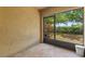 A screened-in lanai with an expansive view of the backyard at 2441 Hibiscus Bay Ln, Brandon, FL 33511