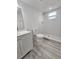 Bathroom features a marble tiled standup shower with tile flooring, a single sink vanity and a toilet at 2712 60Th N Ave, St Petersburg, FL 33714