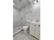 Bathroom features a shower with white marble tiling and hexagon tiling on the floor and a white single sink vanity at 2712 60Th N Ave, St Petersburg, FL 33714