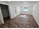 Bedroom with closet and ensuite bathroom access with wood-look flooring and white walls at 2712 60Th N Ave, St Petersburg, FL 33714