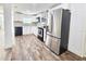 Spacious kitchen featuring stainless steel appliances, granite countertops, and white cabinetry at 2712 60Th N Ave, St Petersburg, FL 33714