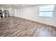 Spacious living room with modern flooring, abundant natural light, and a neutral color palette at 2712 60Th N Ave, St Petersburg, FL 33714