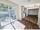 Open living area with wood flooring, sliding glass doors, and views to backyard creates an airy atmosphere at 2712 60Th N Ave, St Petersburg, FL 33714