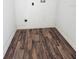 Compact room featuring durable flooring and utility connections, perfect for laundry appliances at 2712 60Th N Ave, St Petersburg, FL 33714