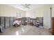 Bedroom with terrazzo floors, partial walls, and bright windows at 2827 1St Ne St, St Petersburg, FL 33704