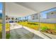 Open carport adjacent to a well-maintained yard with mature landscaping at 2827 1St Ne St, St Petersburg, FL 33704
