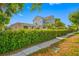 Charming two-story home with lush landscaping, showcasing its inviting curb appeal at 2827 1St Ne St, St Petersburg, FL 33704
