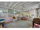 Bright enclosed patio with views of the surrounding yard and mature trees at 2827 1St Ne St, St Petersburg, FL 33704