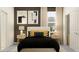 Comfortable bedroom features a bed with decorative pillows, side tables with lamps and modern art pieces on the wall at 31719 Griffin Sands Ln, San Antonio, FL 33576