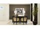 Home office featuring a modern desk with lamps, artwork and two black chairs with decorative backs at 31719 Griffin Sands Ln, San Antonio, FL 33576