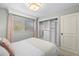 Bedroom features a closet with custom built-ins and soft, natural light at 3310 Valencia Rd, Tampa, FL 33618