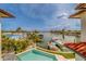 An elevated view of the pool, waterfront, and boat dock of a beautiful luxury property at 362 41St Ave, St Pete Beach, FL 33706