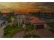 Gorgeous Mediterranean home with lush landscaping, tile roof, two car garage, and brick driveway at 362 41St Ave, St Pete Beach, FL 33706
