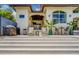 Home backyard with outdoor dining and seating area, a barbeque, and large steps at 362 41St Ave, St Pete Beach, FL 33706