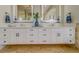 Bathroom features a double vanity with granite countertops and ample storage space beneath the sinks at 362 41St Ave, St Pete Beach, FL 33706