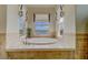 Bathtub with gold hardware surrounded by three large windows offering an amazing view at 362 41St Ave, St Pete Beach, FL 33706