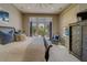 The bedroom features neutral tones, patio access, and comfortable seating area to maximize the relaxation at 362 41St Ave, St Pete Beach, FL 33706