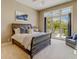 This bedroom boasts beautiful natural light with the large glass doors leading to a private balcony at 362 41St Ave, St Pete Beach, FL 33706